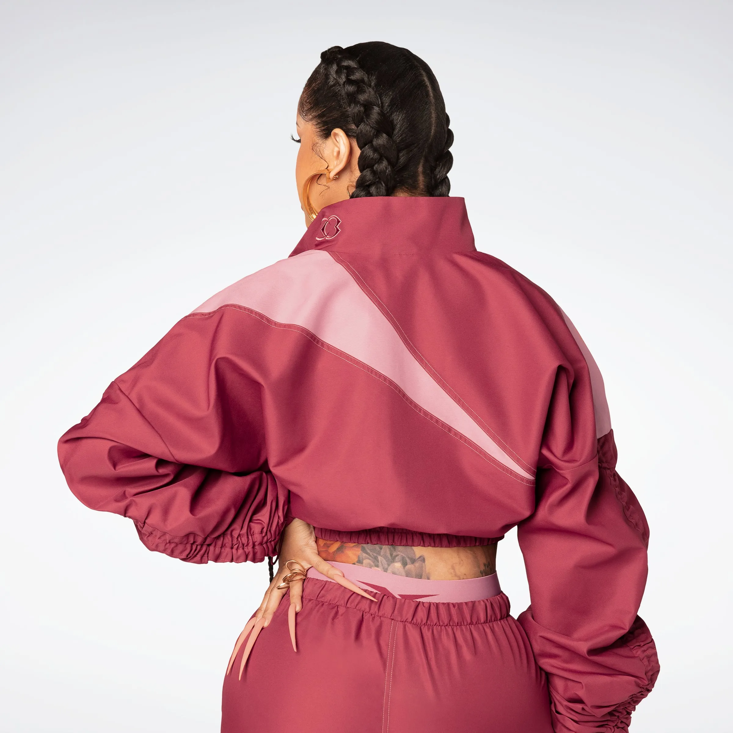 Reebok Apparel Women Cardi B Woven Satin Track Top Trired